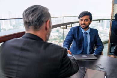 Chief executive officer with secretary meet up with business man Chief executive officer with secretary meet up with business man at the rooftop balcony discuss on business investment